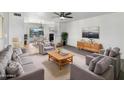 Inviting living room featuring stylish decor, comfortable seating, and a seamless flow to the dining area at 4237 E Clovis Ave, Mesa, AZ 85206