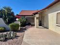 Beautiful front yard with desert landscaping, mature plants, and a red tiled roof at 542 S Higley Rd # 102, Mesa, AZ 85206