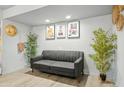 Finished basement area with stylish seating, modern decor, and recessed lighting at 6541 N 41St Ave, Phoenix, AZ 85019