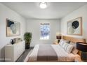 Comfortable bedroom with neutral tones, a large window, and tasteful decor at 842 E Beverly Rd, Phoenix, AZ 85042