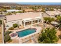 Aerial view featuring a backyard with a private pool, spa, covered patio, and desert landscaping at 15803 E Tumbleweed Dr, Fountain Hills, AZ 85268