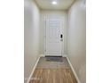 Bright entryway with white door, tiled flooring, and fresh neutral paint at 16243 N 27Th St, Phoenix, AZ 85032