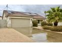 Charming single-story home featuring a two-car garage, desert landscaping and solar panels at 16243 N 27Th St, Phoenix, AZ 85032