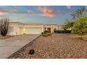 Charming single-story home featuring a 2-car garage, desert landscaping, and a welcoming front entrance at 18833 E Latigo Ln, Rio Verde, AZ 85263