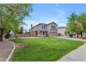 Lovely two-story home showcasing its manicured lawn and inviting curb appeal on a sunny day at 2501 E Los Alamos St, Gilbert, AZ 85295