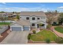 Aerial view of the property featuring lush landscaping, a pool, and a tennis court at 2688 S Racine Ct, Gilbert, AZ 85295