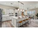 Stylish kitchen features an oversized island with barstool seating and a bright, open floorplan at 28516 N 128Th Dr, Peoria, AZ 85383