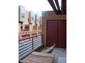 Cozy patio with a railing, offering a relaxing outdoor space with a view of the surrounding townhouses at 330 S Farmer Ave # 121, Tempe, AZ 85281