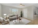 Bright living room featuring a large window, neutral walls, and a ceiling fan at 3402 N 32Nd St # 116, Phoenix, AZ 85018
