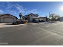 Charming two-story home with a three-car garage and desert landscaping on a quiet street at 3851 E San Pedro Ave, Gilbert, AZ 85234