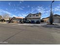 Charming two-story home with a three-car garage and desert landscaping on a quiet street at 3851 E San Pedro Ave, Gilbert, AZ 85234