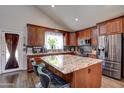 Modern kitchen features granite countertops, stainless steel appliances, and a large island at 4440 W Fallen Leaf Ln, Glendale, AZ 85310