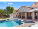 Inviting backyard pool and spa, ideal for relaxation and entertaining on sunny days at 4440 W Fallen Leaf Ln, Glendale, AZ 85310