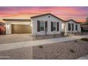 Beautiful single-story home featuring a landscaped yard and attached garage at 5340 S Sabrina --, Mesa, AZ 85212