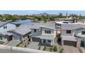 Aerial view of a two-story home with modern design, grey roof, and desert landscaping at 6735 N 9Th Dr, Phoenix, AZ 85013