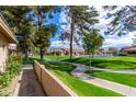 Exterior view of community walking path and green space at 945 N Pasadena St # 61, Mesa, AZ 85201