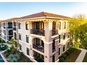 Multi-story building showcases balconies, architectural columns, and well-manicured green landscaping at 11640 N Tatum Blvd # 3074, Phoenix, AZ 85028