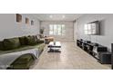 Modern living room with tile flooring, accent wall, comfortable couches, and a bright window with shutters at 1409 E Verlea Dr, Tempe, AZ 85282