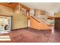Spacious living room featuring a tile floor and an upstairs view to the second story loft at 18845 N 43Rd St, Phoenix, AZ 85050