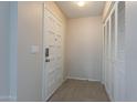 Bright entryway featuring tile flooring, a secure door, and closet storage at 3823 N 28Th St, Phoenix, AZ 85016