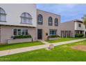 Townhouse exterior showcasing a lush lawn and classic architectural style at 3823 N 28Th St, Phoenix, AZ 85016