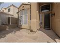 Welcoming front entry featuring a decorative window and stylish black front door at 908 E Mountain Sage Dr, Phoenix, AZ 85048