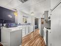 Bright kitchen with appliances, ample cabinet space, a stylish light fixture, and an aquarium creating a unique aesthetic at 120 N Val Vista Dr # 178, Mesa, AZ 85213