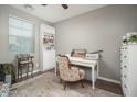 Cozy bedroom with neutral walls, wood floors, and a charming decor at 13346 W Jesse Red Dr, Peoria, AZ 85383