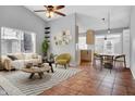 Bright living room featuring modern furnishings, a dining area and easy access to the kitchen at 1717 E Sandra Ter, Phoenix, AZ 85022