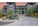 Contemporary building boasting manicured landscaping, modern architecture, and convenient garage access at 18720 N 101St St # 3021, Scottsdale, AZ 85255