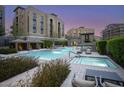 Beautiful swimming pool and spa surrounded by manicured landscaping and inviting lounge areas at 18720 N 101St St # 3021, Scottsdale, AZ 85255