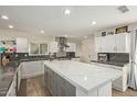 Spacious kitchen featuring a large island with white countertops and modern stainless steel appliances at 1974 E Vinedo Ln, Tempe, AZ 85284