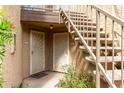 Condo entrances featuring white security doors and stairwell to upper units at 2228 N 52Nd St # 117, Phoenix, AZ 85008