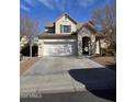 Charming two-story home featuring a two-car garage and stone entryway, complemented by desert landscaping at 2730 E Vermont Dr, Gilbert, AZ 85295