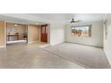 Inviting living room with tile floors, neutral walls, a ceiling fan, and natural light at 2923 N 63Rd St, Mesa, AZ 85215