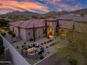 Aerial view of a luxurious backyard with fire pit, seating area and desert landscaping at 32754 N 15Th Gln, Phoenix, AZ 85085