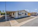 Cozy single-story home featuring a covered carport and low-maintenance landscaping at 3330 E Main St # 7, Mesa, AZ 85213