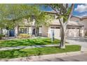 Charming two-story home with lush green lawn and mature shade tree at 3336 E Linda Ct, Gilbert, AZ 85234