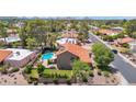 Beautiful aerial view of a home highlighting the pool, backyard, and surrounding neighborhood at 5045 E Redfield Rd, Scottsdale, AZ 85254