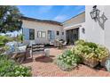 Charming patio area with stylish outdoor furniture and beautiful landscaping at 5446 E Exeter Blvd, Phoenix, AZ 85018