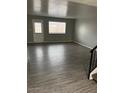 Spacious living room with gray walls and laminate flooring at 7126 N 19Th Ave # 103, Phoenix, AZ 85021