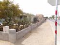 Street view of a charming single-story home with a xeriscaped front yard and a block wall at 8846 N 3Rd St, Phoenix, AZ 85020