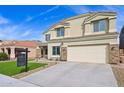 Exterior view of a two-story stucco home with an attached garage and well-maintained artificial turf lawn at 9574 W Quail Ave, Peoria, AZ 85382