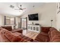 Spacious living room features a ceiling fan and sliding glass doors at 1885 S 217Th Ave, Buckeye, AZ 85326