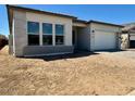 Charming single-story home with a neutral color scheme and a spacious two-car garage at 22685 E Saddle Way, Queen Creek, AZ 85142