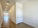 Bright hallway with tiled floors and recessed lighting, leading to the living areas at 22685 E Saddle Way, Queen Creek, AZ 85142