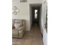 Neutral hallway features tile flooring, neutral wall colors, and mirrored decor at 2530 W Berridge Ln # E201, Phoenix, AZ 85017