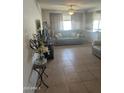 Inviting living room features tile flooring, natural light, and comfortable seating at 2530 W Berridge Ln # E201, Phoenix, AZ 85017