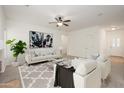 Spacious living room with modern decor, a stylish rug, and neutral toned walls at 2560 E Indian Wells Pl, Chandler, AZ 85249