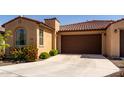 Charming single-story home featuring mature desert landscaping and a two-car garage at 5383 N 205Th Dr, Buckeye, AZ 85396